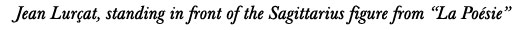 Jean Lurcat, standing in front of La Poesie